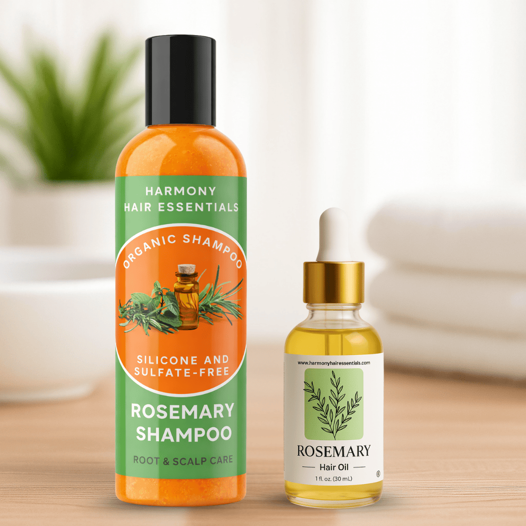Harmony Hair Essentials rosemary shampoo bottle and hair oil dropper on a wooden surface with a blurred background.